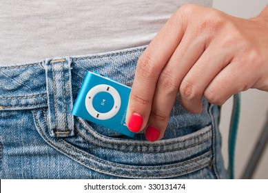 Blue mp3 player isolated on jean.