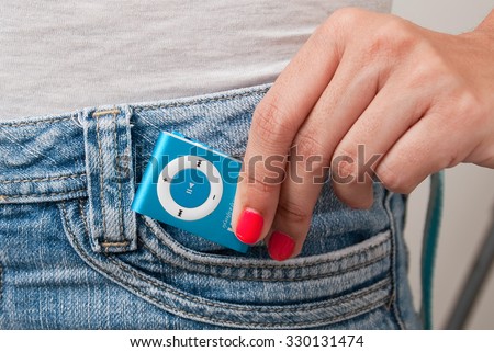 Blue mp3 player isolated on jean.