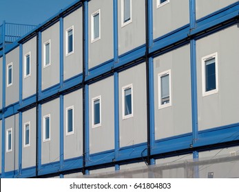 Blue multi-storey temporary offices at a large building development in the UK