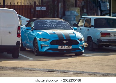 Blue Mustang Car With Rental Banner. Russia, Sochi November 2021. Rent Of Expensive Cars In The Resort Town.