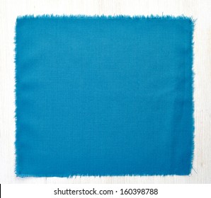 Blue Napkin On White Wooden Table, Top View