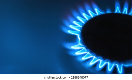 Blue Natural Gas Flame With Space For Text On Blue Background Close Up Soft Selective Focus