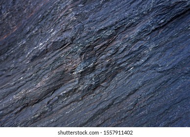 Blue natural marble stone texture pattern background. Rough natural stone marble texture surface with cracks, dents, sharp edges. Cobalt blue grungy textured backdropcobalt blue texture