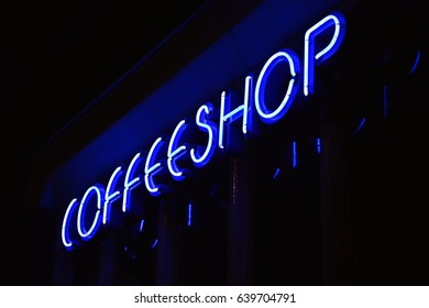 A Blue Neon Sign Of A Coffeeshop (coffee Shop) - In Amsterdam, Holland