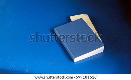 blue notebook on blue background