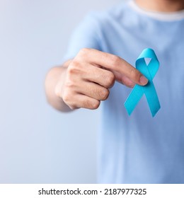 Blue November Prostate Cancer Awareness month, Man in blue shirt with hand holding Blue Ribbon for support people life and illness. Healthcare, International men, Father, Diabetes and World cancer day - Shutterstock ID 2187977325
