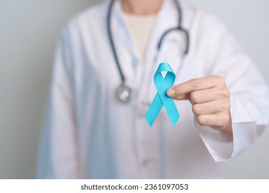 Blue November Prostate Cancer Awareness month, Doctor with Blue Ribbon in hospital for support people life and illness. Healthcare, International men, Father, Diabetes and World cancer day - Powered by Shutterstock