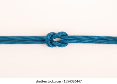 Blue Nylon Rope In Square Knot On White