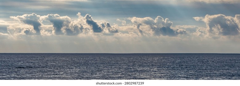 Blue Ocean with Dramatic Sky and Clouds over Sea Horizon in Sere