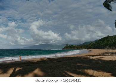 blue ocean with sandy shore