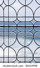 Blue Ocean And Surf Through An Old Lead Glass Window