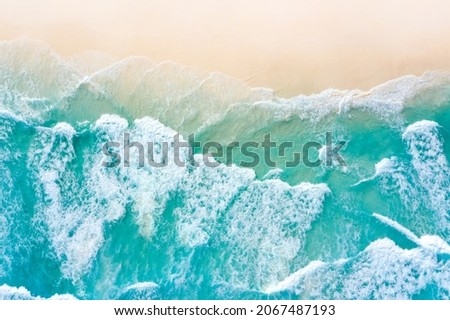 Similar – Luftaufnahme Panoramadrohne Blick auf den blauen Ozean Wellen, die am Sandstrand in Portugal erdrücken.