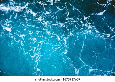 Blue Ocean Water Texture, Surface. Top View Of Aqua Blue Clear Sea Ocean. Beautiful Blue Sea Water Background.