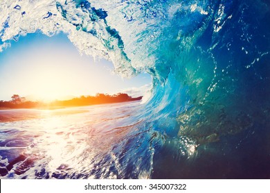 Blue Ocean Wave Crashing at Sunrise