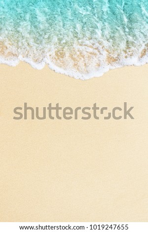 Blue ocean wave on sandy beach