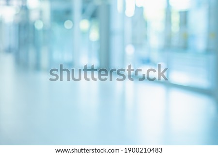 BLUE OFFICE BACKGROUND WITH WINDOW LIGHT REFLECTIONS AND CITY VIEW