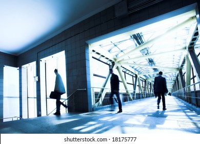 Blue office corridor, people mooving near staircase - Powered by Shutterstock