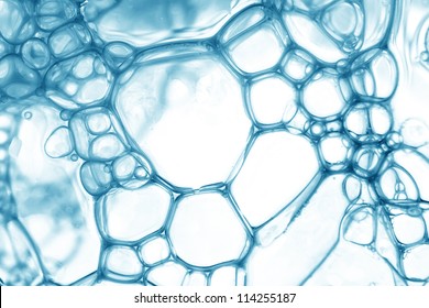 Blue Oil Bubbles In Water Close Up.