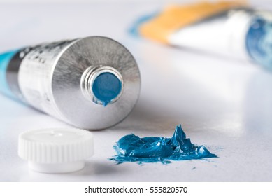 Blue Oil Paint With Paint Tube, Cap, And Paintbrush