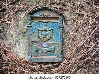 Blue Old Mailbox On The Wall 