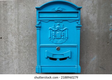 Blue Old Vintage Mail Box On A Street Wall