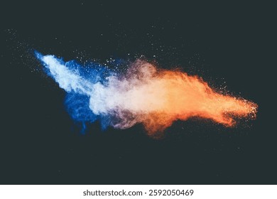 Blue orange color powder explosion cloud on black background. Closeup of Blue orange dust particles splash.