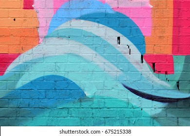 Blue and Orange Spray Paint on Brick