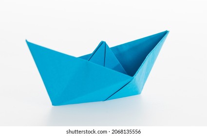 Blue Origami Boat On White Background.