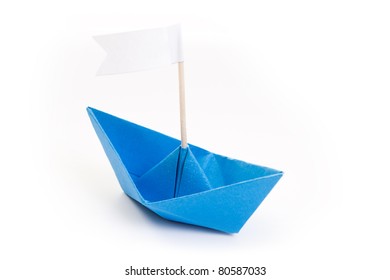 Blue Origami Boat With White Flag