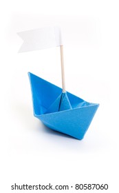 Blue Origami Boat With White Flag