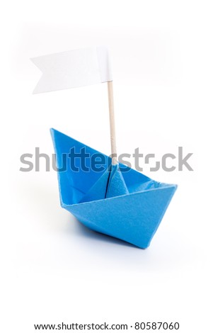 blue origami boat with white flag