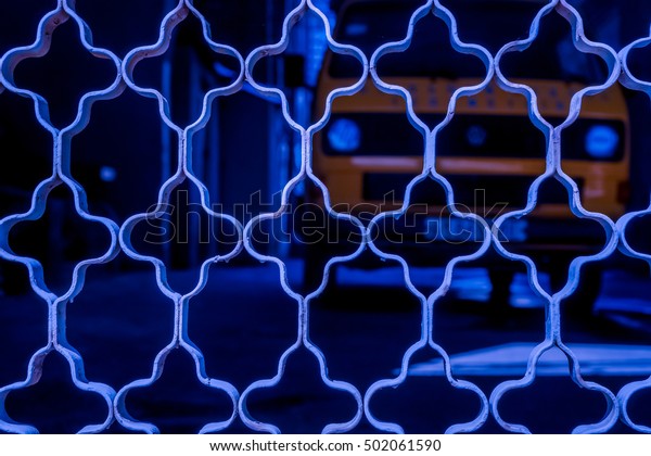 blue ornament grid on dark background with big\
car, red netting against dark back, netting grid as texture, high\
quality resolution