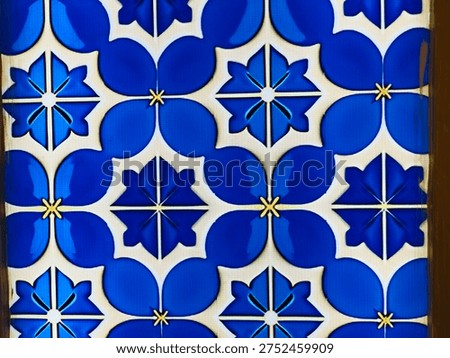 Blue ornamental Islamic tile pattern with geometric symmetry. Traditional decorative motif used in mosque walls and Islamic art background. 
