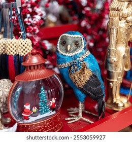 A blue owl as a souvenir for under the Christmas tree and Christmas ornaments at a flea market. - Powered by Shutterstock