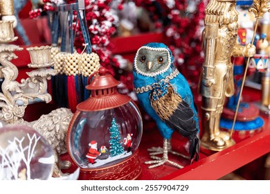 A blue owl as a souvenir for under the Christmas tree and Christmas ornaments at a flea market. - Powered by Shutterstock