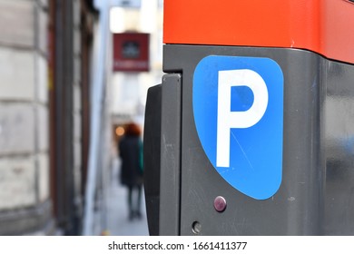Blue 'P' sticker on European parking pay and display machine