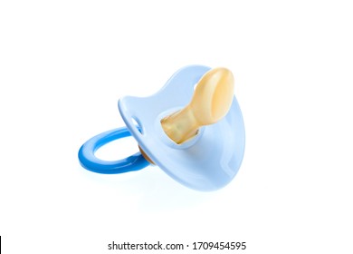 a blue pacifier made of soft silicone  isolated on white background side view, nobody.