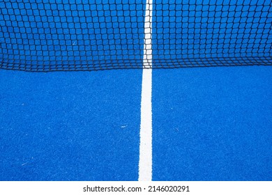 blue paddle tennis court, net view
