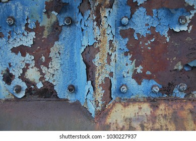 Blue Paint Chipping Off Rusty Metal