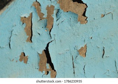 Blue Paint Chipping Off A Wall