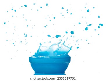 Blue paint water spill splash in bowl cup. Blue liquid lotion moisturizer cosmetic pour float in mid air. Blue cocktail drink explosion throw fluttering. White background isolated high speed shutter - Powered by Shutterstock