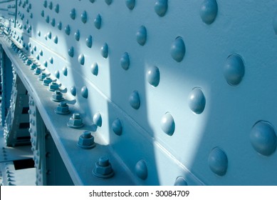 Blue Painted Bridge Steel Construction Close Up With Bolts And Nuts