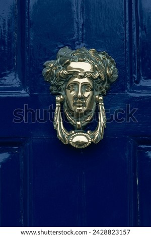 Blue painted door and knocker in the centre of the city of dublin, eire, europe