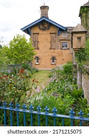 Blue Painted Railings Enclose A Beautiful Cottage Garden In The Deryshire Village Of Edensor.