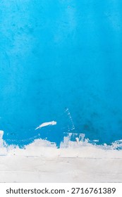 Blue painted wall texture background with abstract blue paint surface, modern painted wall backdrop, artistic blue texture design.
