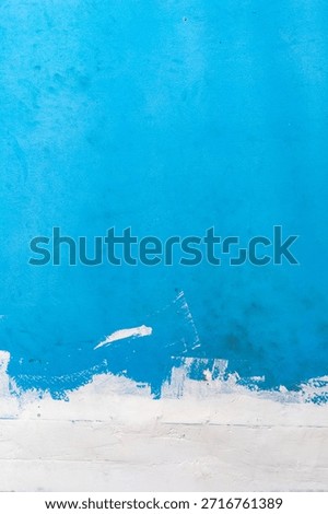 Blue painted wall texture background with abstract blue paint surface, modern painted wall backdrop, artistic blue texture design.