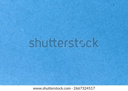 blue paper background texture light rough textured spotted blank copy space background in blue 