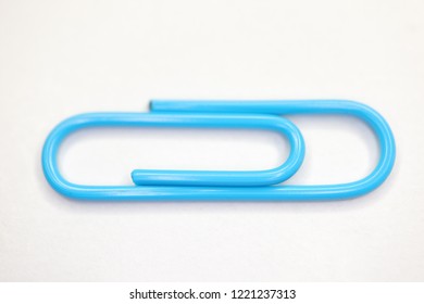 Blue Paper Clip On Isolate Background Stock Photo 1221237313 | Shutterstock