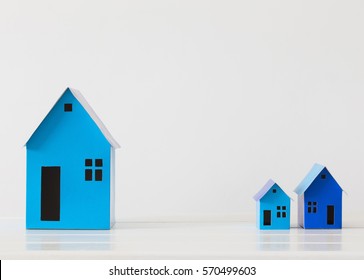 blue paper houses on white background