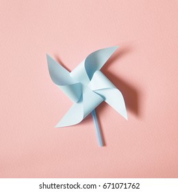 Blue Paper Pinwheel On Pink Background